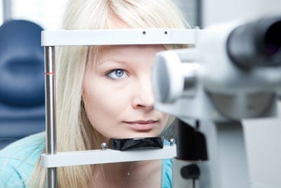 blonde woman at optometrist adter taking Elmiron