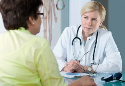 doctor discussing multiple sclerosis (MS) with her patient